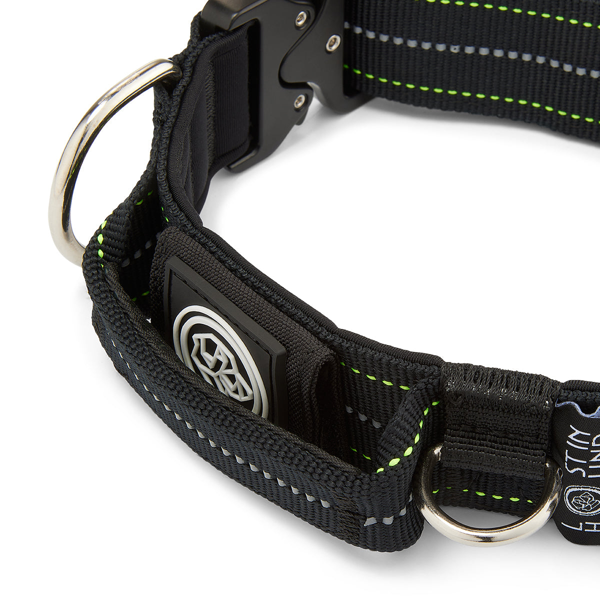 Close-up of a black dog collar with reflective stripes on a white background