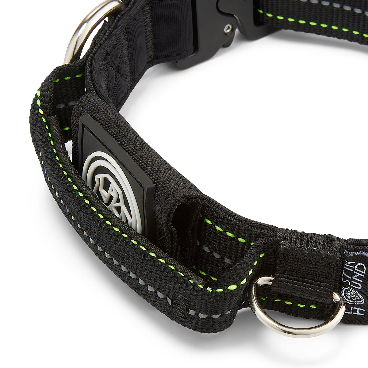 Black dog collar with green stitching on a white background
