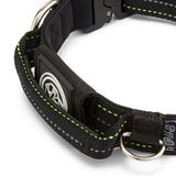 Black dog collar with green stitching on a white background